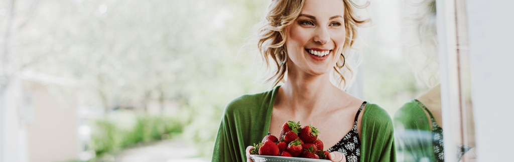 Woman with a bunch of strawberries